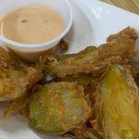 Fried Pickles · Sliced pickles dipped in our own batter with a blend of herbs and spices. Side of Thousand I...