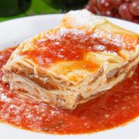 Homemade Meat Lasagna · Layers of pasta with bolognese and bechamel sauce.