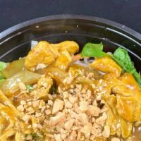 Yellow Curry Noodle Salad · Rice noodles topped with your choice of beef, chicken, pork, or tofu stir fried with onions ...