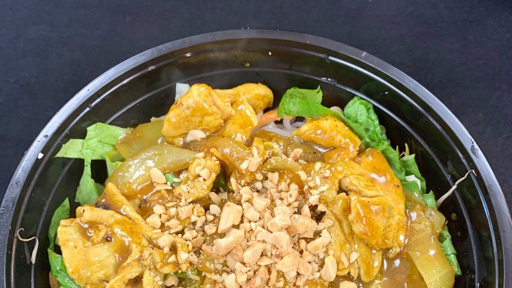 Yellow Curry Noodle Salad · Rice noodles topped with your choice of beef, chicken, pork, or tofu stir fried with onions in a light yellow curry sauce. Topped with shredded carrots, bean sprouts, shredded lettuce and crushed peanuts.