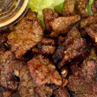 Korean Bbq (Bulgogi) · Marinated grilled beef. Served with lettuce and a mild dipping sauce.