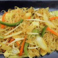Singapore Noodles · Stir fried thin rice vermicelli noodles with bell peppers, onions, carrots, bean sprouts, an...