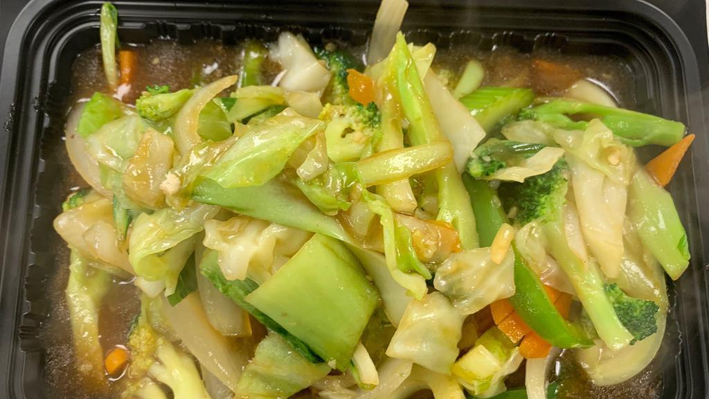 Buddhas Delight · Tir fried baby bok choy, onions, cabbage, carrots, bell peppers, shitake mushrooms, ginger, broccoli, and green onions in a light gravy.