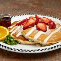 Sweet Cream Pancakes With Fresh Strawberries & Lemon Cream · Our one-of-a-kind sweet cream pancakes topped with a sweet-tart lemon cream sauce made in-ho...