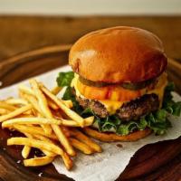 The Buffalo Burger · Beef patty with caramelized onions, shredded lettuce, blue cheese crumbles, and buffalo sauc...