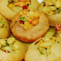 Gol Gappa · 6 pieces of crispy puri shells filled with a mixture of seasoned chickpeas and diced potatoe...
