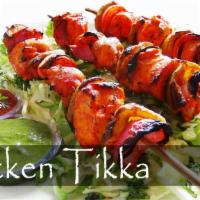 Chicken Tikka · Chunks of white meat chicken marinate over night in spiced yogurt and cooked on a skewer