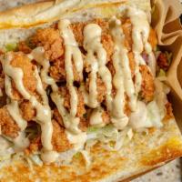 Gator Po Boy · Gator Po' Boy comes with lettuce, pickles, tomatoes, & your choice of sauce, loaded on top o...