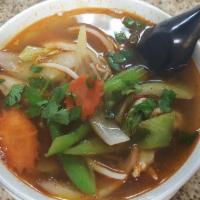 Tom Yum Goong · Hot. Lemon grass, mushroom, onion, bell pepper, carrot, cilantro, chili, lime juice served w...