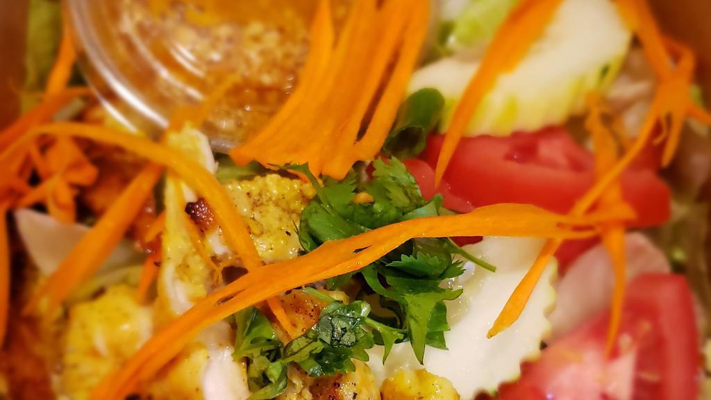 Grilled Satay Salad · Grilled chicken, garden fresh green salad with peanut dressing.