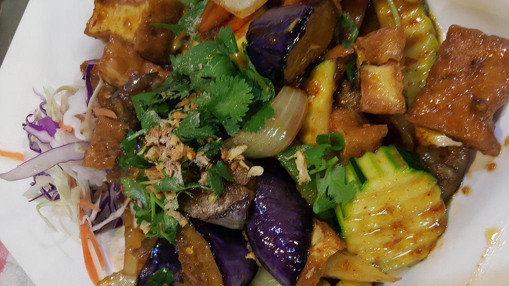 Spicy Eggplant · Hot. Egg plant with chili sauce, bell pepper, carrot, onion, sweet basil, in home made sauce.