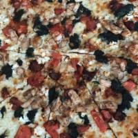 Greek Pizza · Lamb gyro meat, feta, tomatoes, banana peppers, onions and black olives.