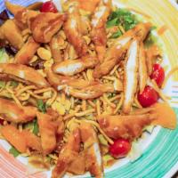 Oriental Chicken Salad · Mixed greens, tomatoes, mandarin orange segments, almond flakes and breaded chicken tenderlo...