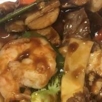 Happy Family · A dish with lots of meat, beef, scallop, chicken, shrimp, lobster and roast pork cooked with...