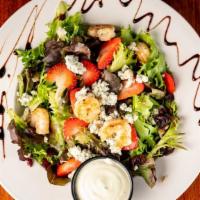 Grilled Shrimp Salad · Blackened grilled shrimp on a bed of field greens with craisins, strawberries, sunflower see...