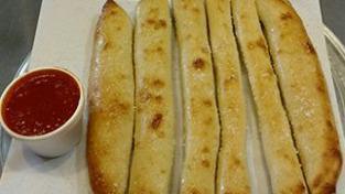 Garlic Breadsticks · 6 breadsticks with marinara sauce.