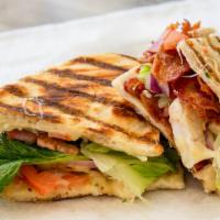 Grilled Chicken Club · Grilled chicken breast, bacon, basil pesto, olives, red onions, pepper jack cheese.