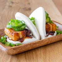 Pork Belly Buns · Steamed buns filled with pork belly, pickled cucumbers,  hoisin, scallions, and sesame seeds..