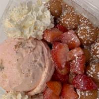 Strawberry Cheesecake Creation · Original puffle, strawberry cheesecake ice cream, whipped cream, graham cracker crumbs, stra...