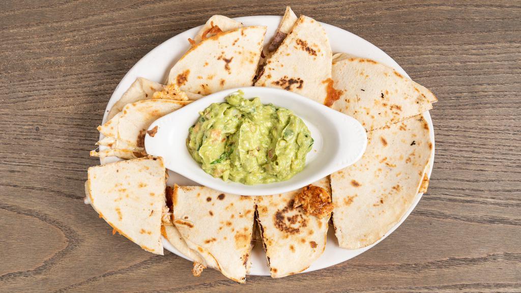Botana Quesadilla · (8pcs) flour tortilla filled w/monterrey jack cheese, lightly grilled and served w/ guacamole, pico de gallo  & sour cream.
 (your choice of meat)