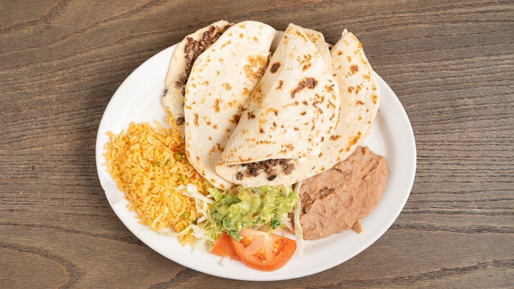 Quesadilla Plate · 3 small quesadillas  filed w/ Monterrey Jack Cheese, served w/Rice,  Beans   & salad.