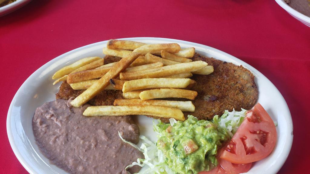  Milanesa Plate  · Breaded steak,served w/ refried beans , French fries & small salad.