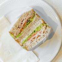 Turkey Breast Sandwich · Turkey breast swiss cheese shredded carrots lettuce tomato and cucumber with mayonnaise.