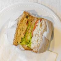 Chicken Salad Sandwich · Freshly made chicken salad with swiss cheese shredded carrots lettuce tomato and cucumber.