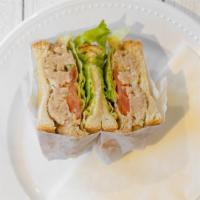 Tuna Salad Sandwich · Albacore tuna salad swiss cheese shredded carrots lettuce tomato and cucumber.