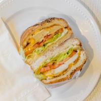 Grilled Chicken Sandwich · Grilled chicken breast, Cheddar cheese, lettuce, tomato, and mayonnaise on sesame kaiser rol...