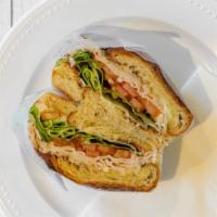 Natural High Croissant · Real breast of turkey layered with Swiss cheese, lettuce, tomato, and mayonnaise on a croiss...