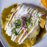 Enchiladas · 3 corn tortillas stuffed with cheese topped with poblano sauce, crema ,and queso fresco