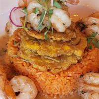 Camarones Al Ajillo · Shrimp in garlic sauce, rice and tostones.