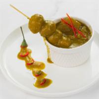 Street Style Curry Fishballs · Fried fishballs and radish simmered in a savory, mildly spicy curry sauce. A classic favorite.