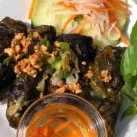 Beef Grilled In Grape Leaves · Four pieces. Ground beef rolled in grape leaves and grilled. Topped with peanuts.