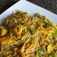 Veggie Saigon Noodle · Thin rice noodles stir-fried with tofu, egg, shredded carrots and snow peas and curry powder.