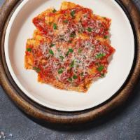 Cheesy Blanket Ravioli  · (Vegetarian) Fresh cheese ravioli pasta cooked with homemade red sauce and topped with black...