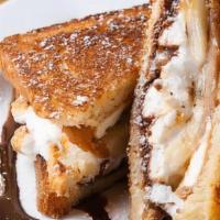 Elvis · grilled challah bread, peanut butter cream cheese honey mix, banana slices, marshmallows, ha...