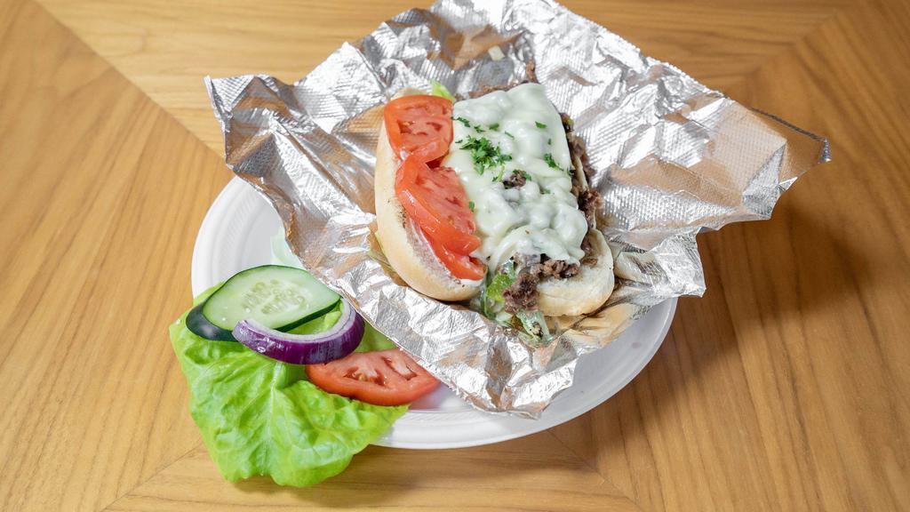 Philly Steak Sandwich · Philly steak, bread, onions, green pepper and melted swiss cheese.