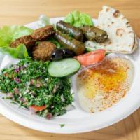 Veggie Sample Plate · Served with rice or salad, pita bread, two falafel, hummus, three grape leaves and your choi...