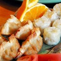 Gyoza / 日式餃子 · Japanese chicken dumplings; served steamed or fried with house specialty dumpling sauce (6 p...