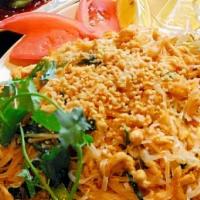 Pad Thai / 泰式炒米粉 · Thai stir-fried rice noodles with egg, crushed peanuts, and scallions.