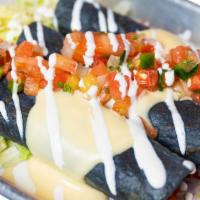 Chicken Flautas · 3 crispy hand rolled blue corn tortilla stuffed. with chicken, topped with melted queso, pic...