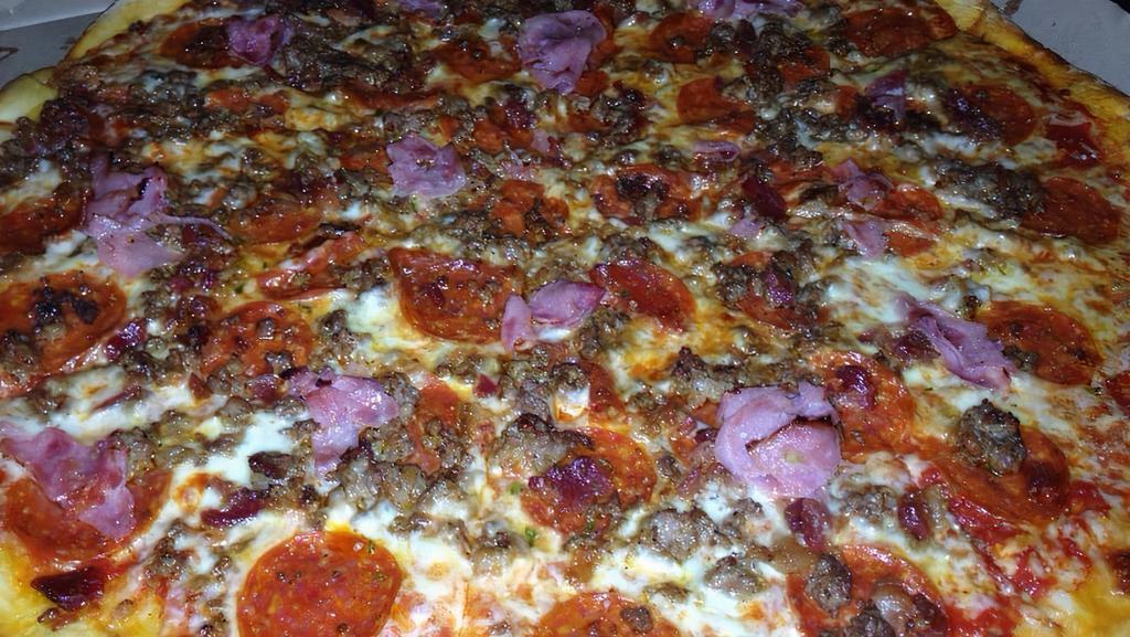 Meat Fest Pizza · Pepperoni, ground beef, ham, sausage and bacon with mozzarella cheese and pizza sauce.