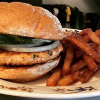 Salmon Burger · Seasoned salmon patty, lemon aioli, avocado aioli, pickles, lettuce, tomato, onion. Served w...