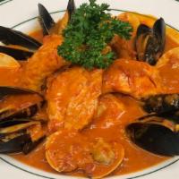Zuppa Di Pesce · Clams, mussels, shrimp, salmon, saffron broth.