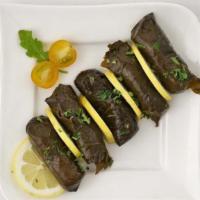Dolma · Fresh homemade grape leaves stuffed with rice herbs spices parsley and onion gluten-free veg...