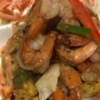Mofongo Camarones Al Ajillo · Mofongo with garlic shrimp salad.
