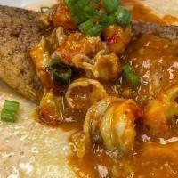 Catfish & Grits · Deep fried catfish topped with crabmeat over creamy cheddar grits with Old Bay aioli & garli...