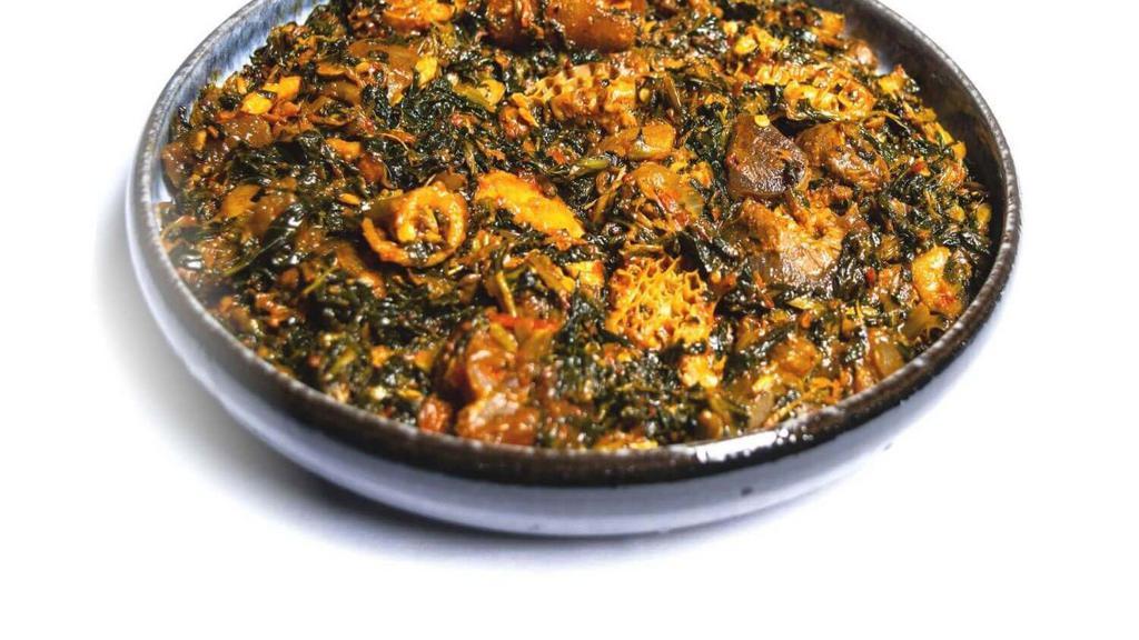 Efo/Spinach · This delicious dish is filled with flavor! By combining tomatoes, spinach, meat, peppers, and fish, you’ll get a little bit of everything on your plate – and you’ll probably want to go for seconds!